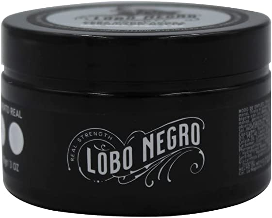 Frasco circular negro mate. En la entiqueta se alcanza a leer 'Lobo negro' con letras estilizadas color blanco.
